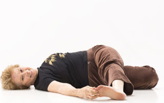 Bea Ammidown in lying down twist