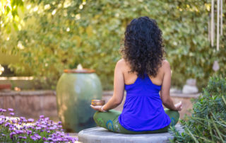 Meditation is a form of self-care and self love, Meditating by the pond