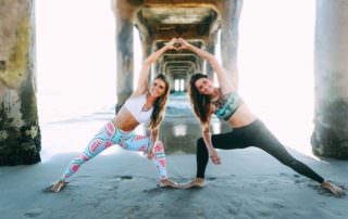 Tone it Up Founders Karena Dawn and Katrina Scott workout on the beach