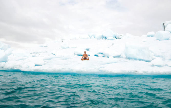 Iceman Wim Hof sitting on the ice