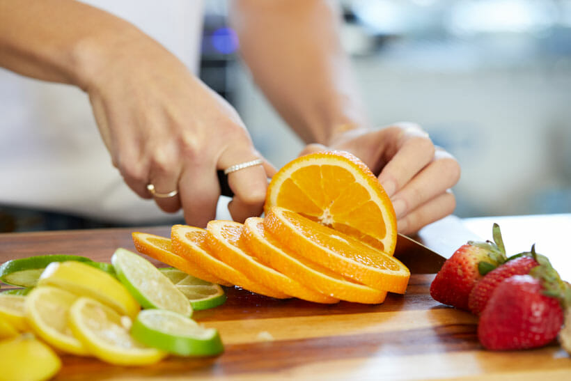 Slicing oranges for meal prep 