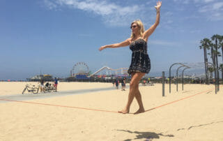 Karen Henry slacklining on Santa Monica Beach