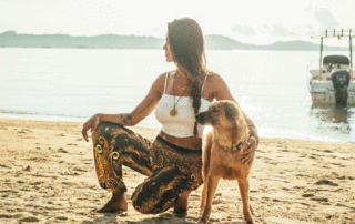 Woman Wearing Bohemian Island Pants with Dog in Thailand