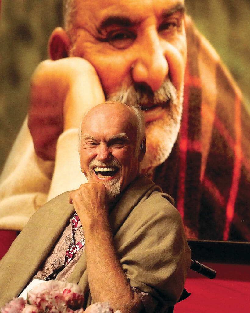 Ram Dass with photo of Neem Karoli Baba
