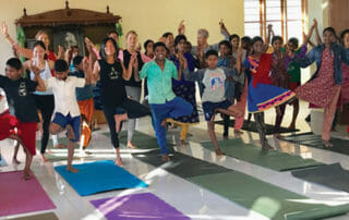 Yoga Gives Back Group Doing Yoga