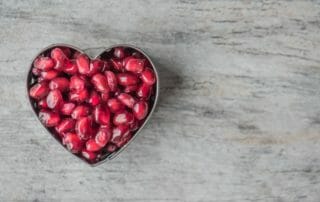 healthy heart and pomegranate seeds