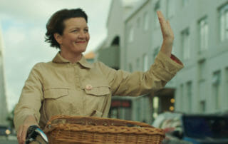Halladora on a bicycle in Woman at War