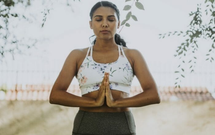 Woman Meditating in Yoga Pose