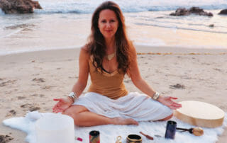 Karen Seva Practicing Sound Healing on the Beach