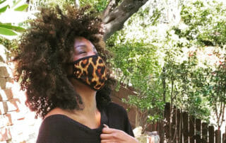 Venius wearing leopard face mask