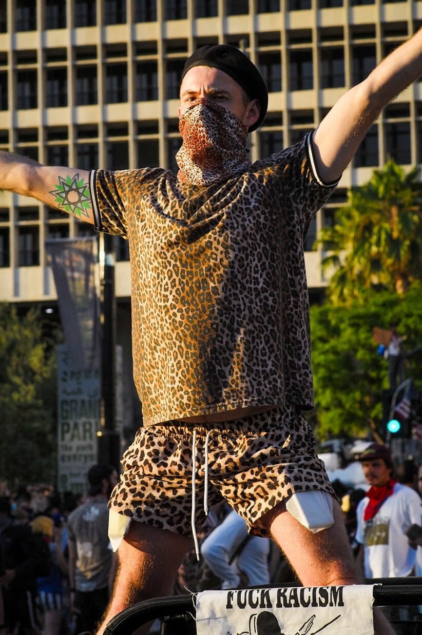 Man in leopard clothes at City Hall.