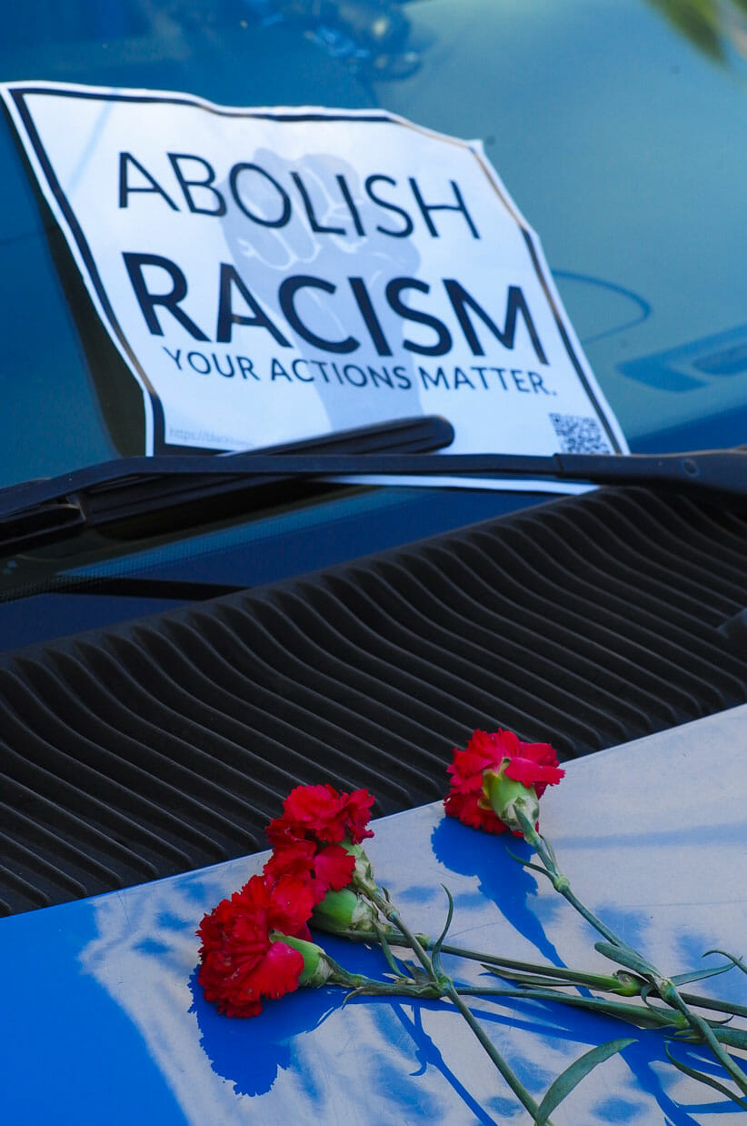 Abolish Racism car shrine at City Hall.