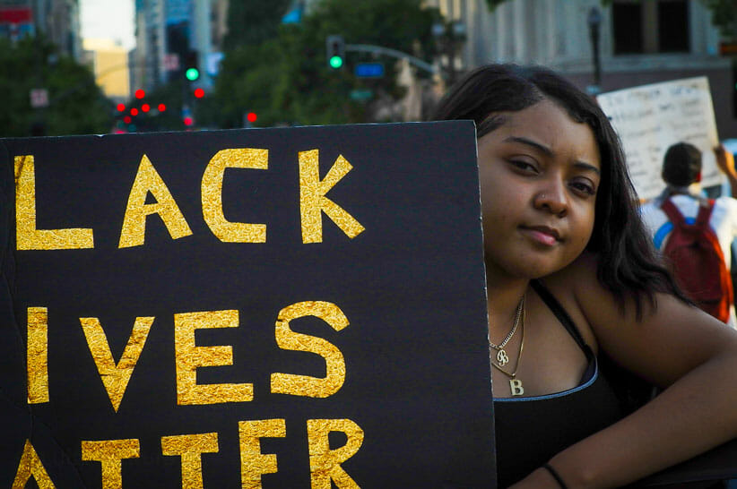 Protestor downtown in Los Angeles with Black Lives Matter Sign