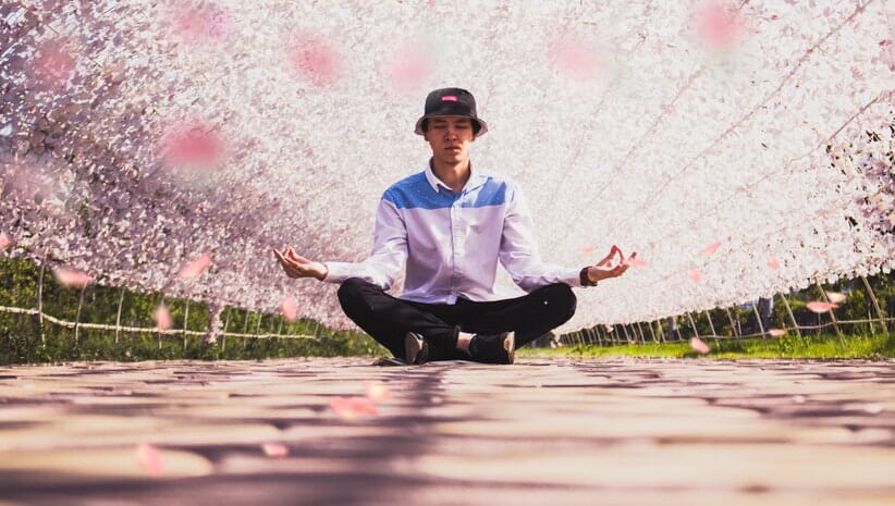 person meditating because meditation helps with stress