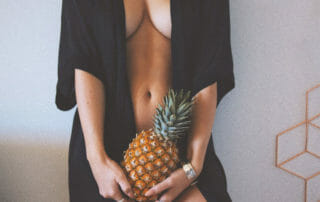 Sensual Woman with pineapple demonstrating increase your sex drive