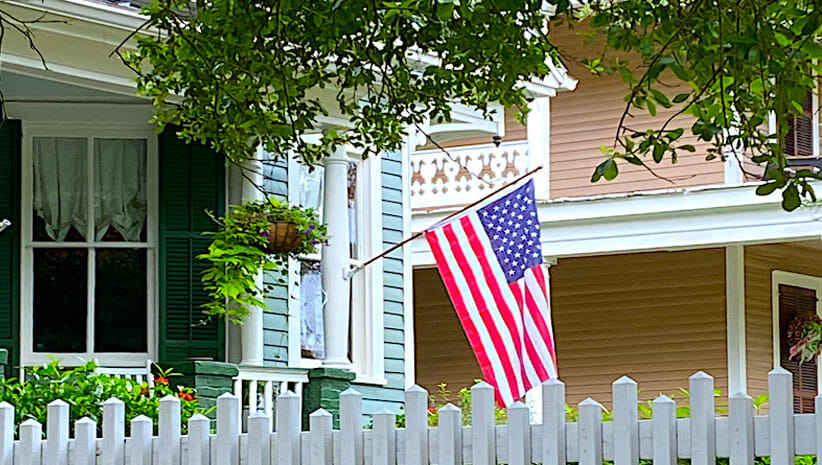 Celebrate freedom with a flag flying at a house
