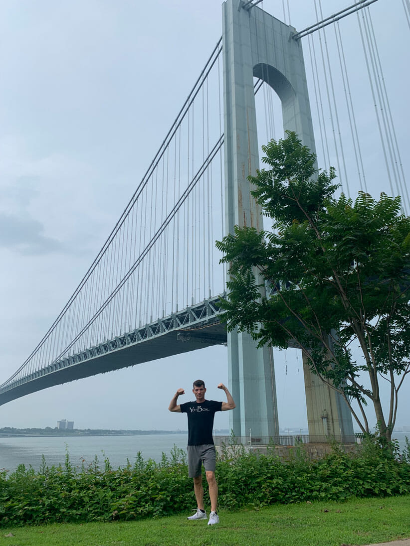 Thomas Taubman posing in a sparring shape at a bridge