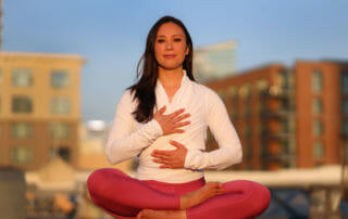 Dr Ingrid Yang in a Yoga Pose