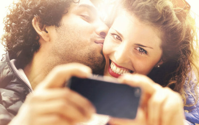 couple taking a selfie manifesting love