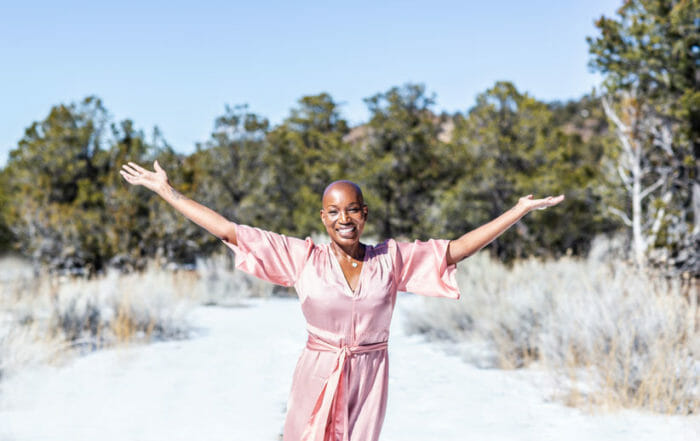 Tracee Stanley Author of Radiant Rest with her hands in the air
