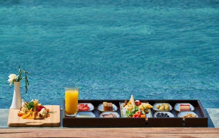 eat clean while traveling spread of food by the water