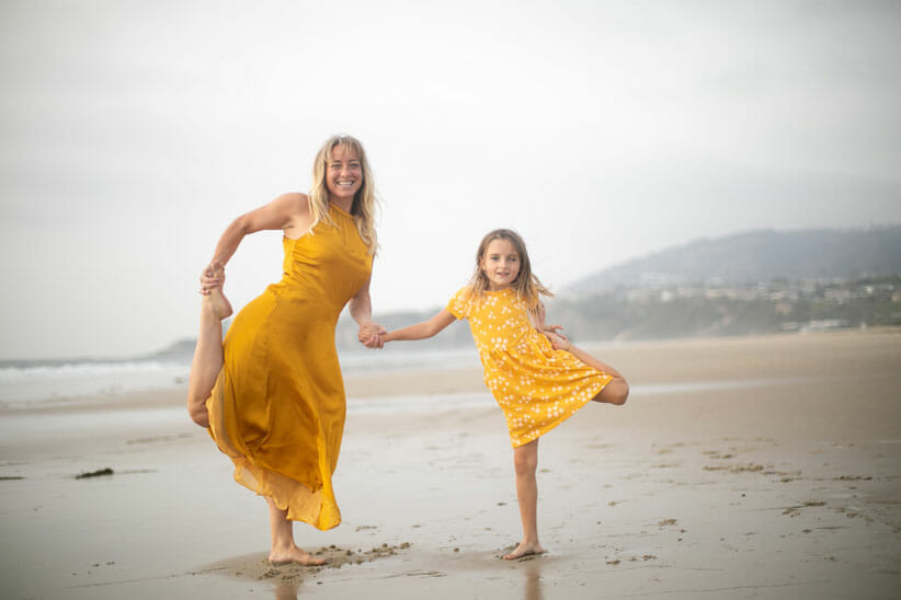 Natiya Guin and daughter wearing yellow dresses on the beach showing heathy skin from within