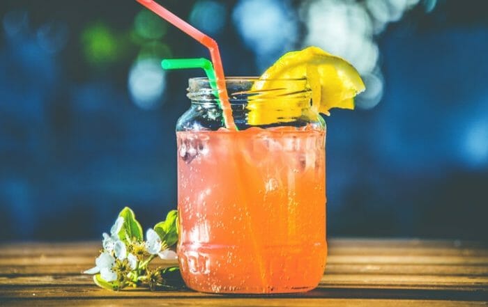 mason jar with juice and lemon as part of a detox with ease program