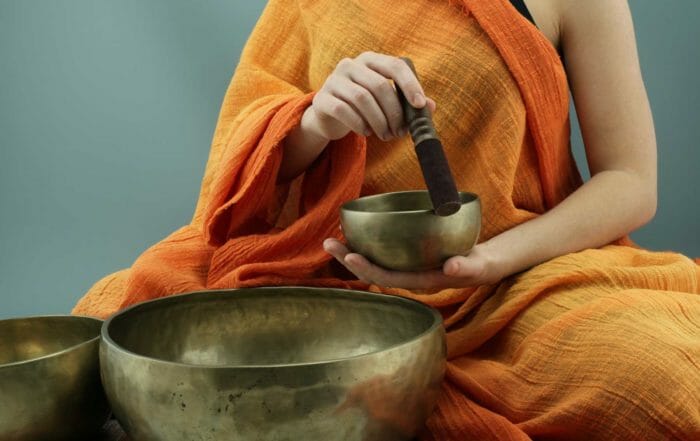 person holding meditation bowl to show easiest meditation techniques