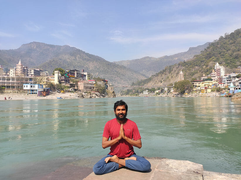 yoga teacher Bodhi Abhishek Singh on the Ganga River in Rishikesh