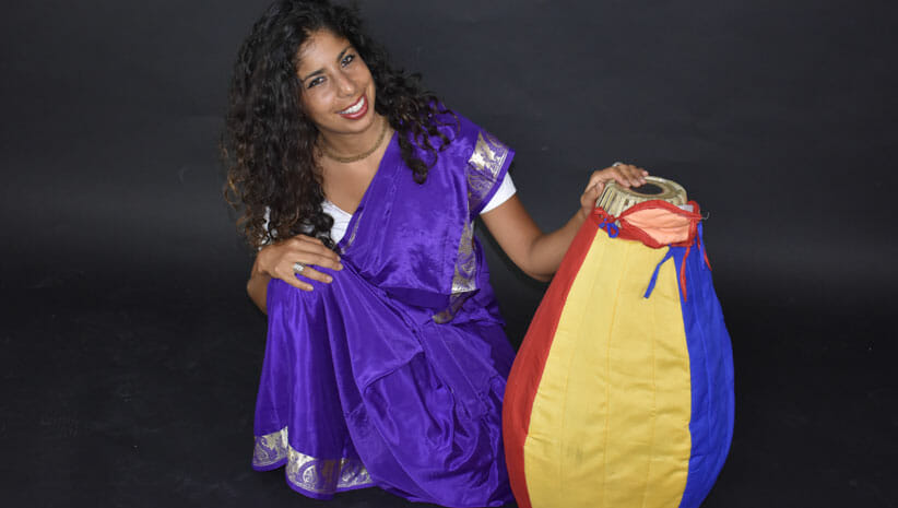 Bhakti Love Reunion Artist Vaideihi wearing purple with a drum