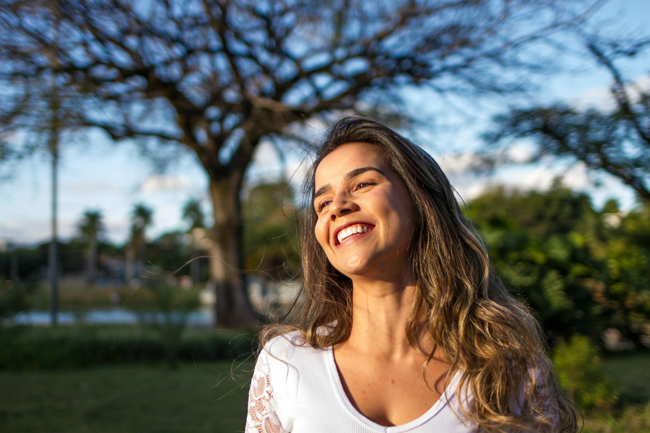 Woman with brown hair smiling Raise Your Personal Bar