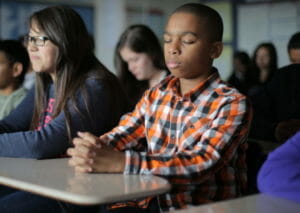 Children meditating in school courtesy DLF