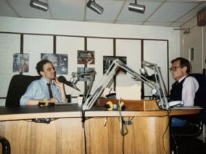Bob Roth and Larry king radio interview at desk