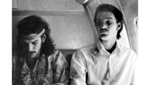 Mickey Hart with Bill Kreutzmann on plane, 1968 c. Rosie McGee