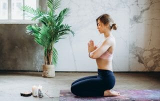 woman meditating with crystals to protect yourself from curses
