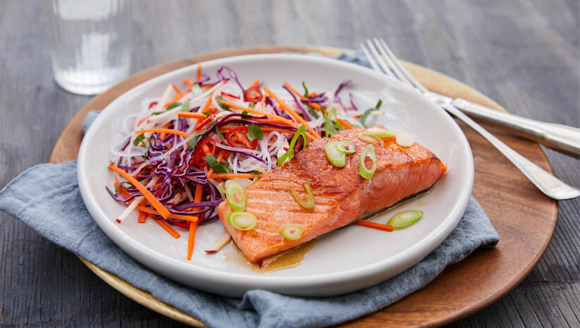 honey lime salmon with coleslaw on plate 