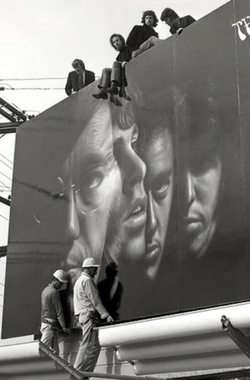 Black and white billboard with people