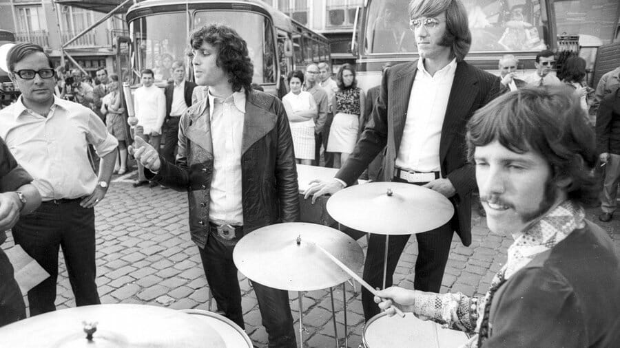 John Densmore plays drums in Germany, band looks on black and white