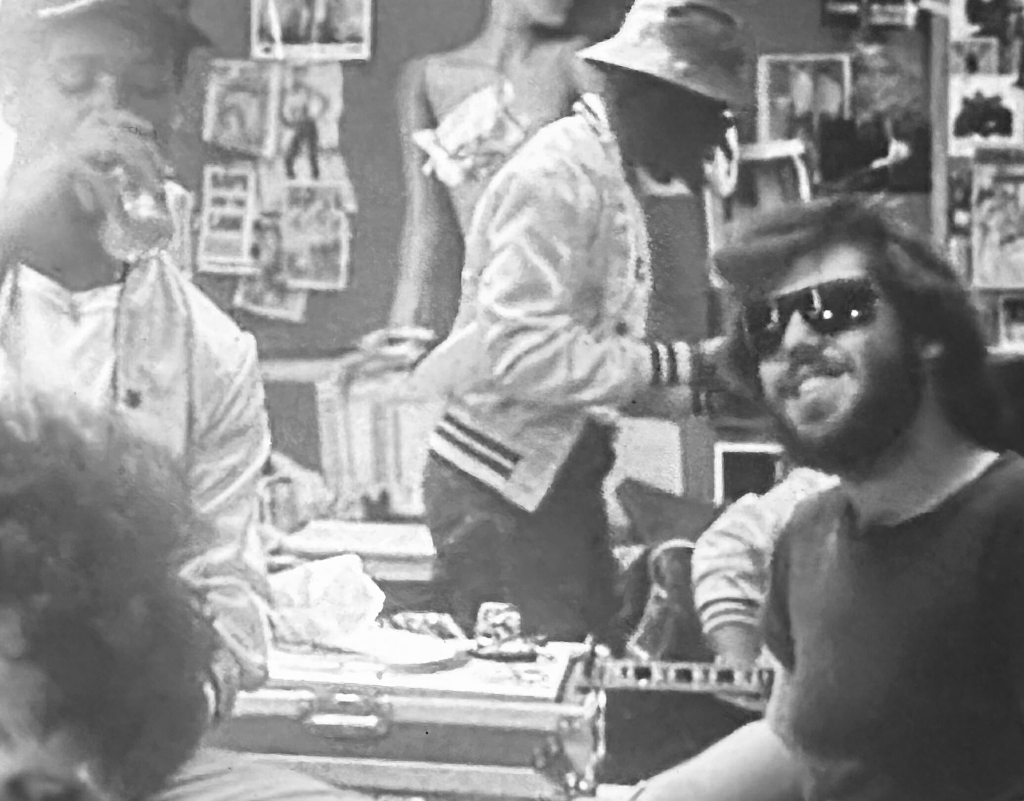 Movie still, man with sunglasses black and white
