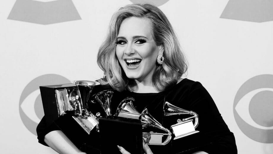 Adele with her Grammys black and white