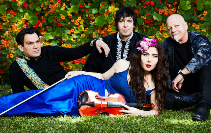 members of band opium moon outside on a grassy area