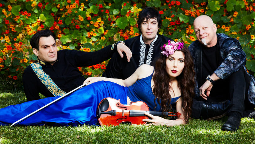 members of band opium moon outside on a grassy area
