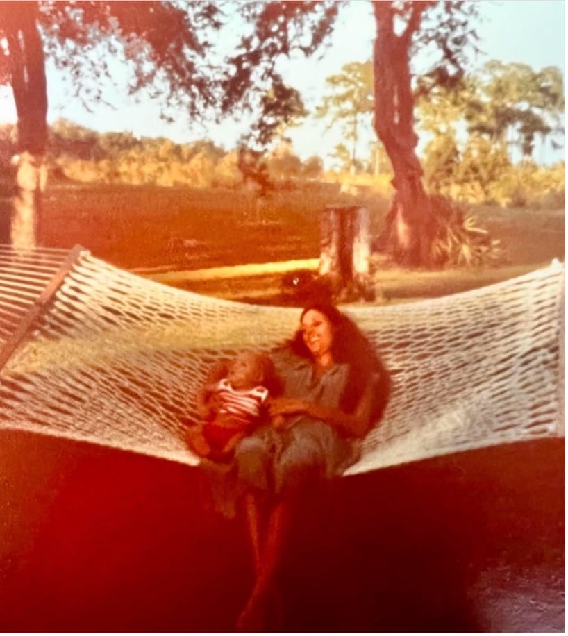 woman and baby in hammock