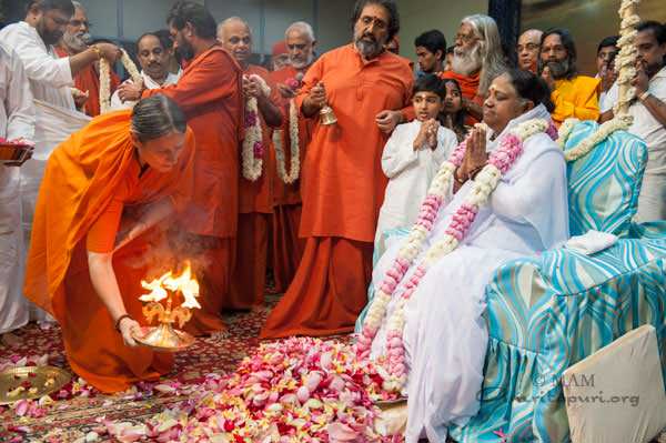 Amma and devotees birthday colorful with flowers and Aarti fire ceremony