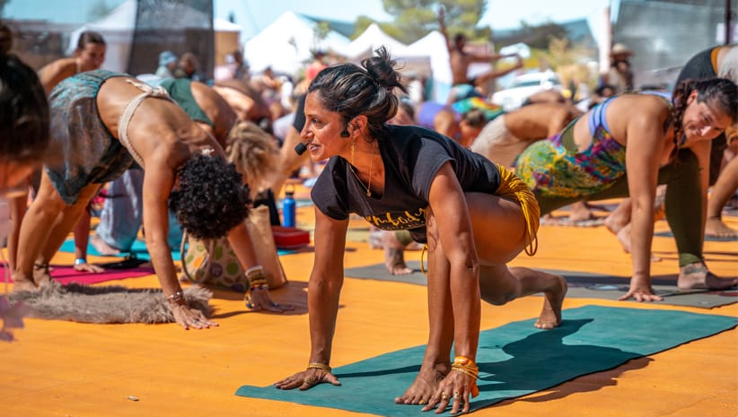 Yoga teacher Hemalayaa leading a class at Bhakti Fest