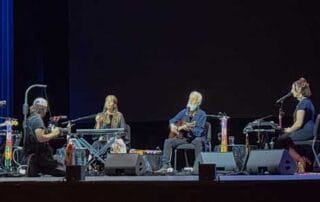 Deva Premal and Miten on stage with musicians