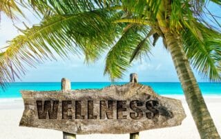wellness sign at a beach